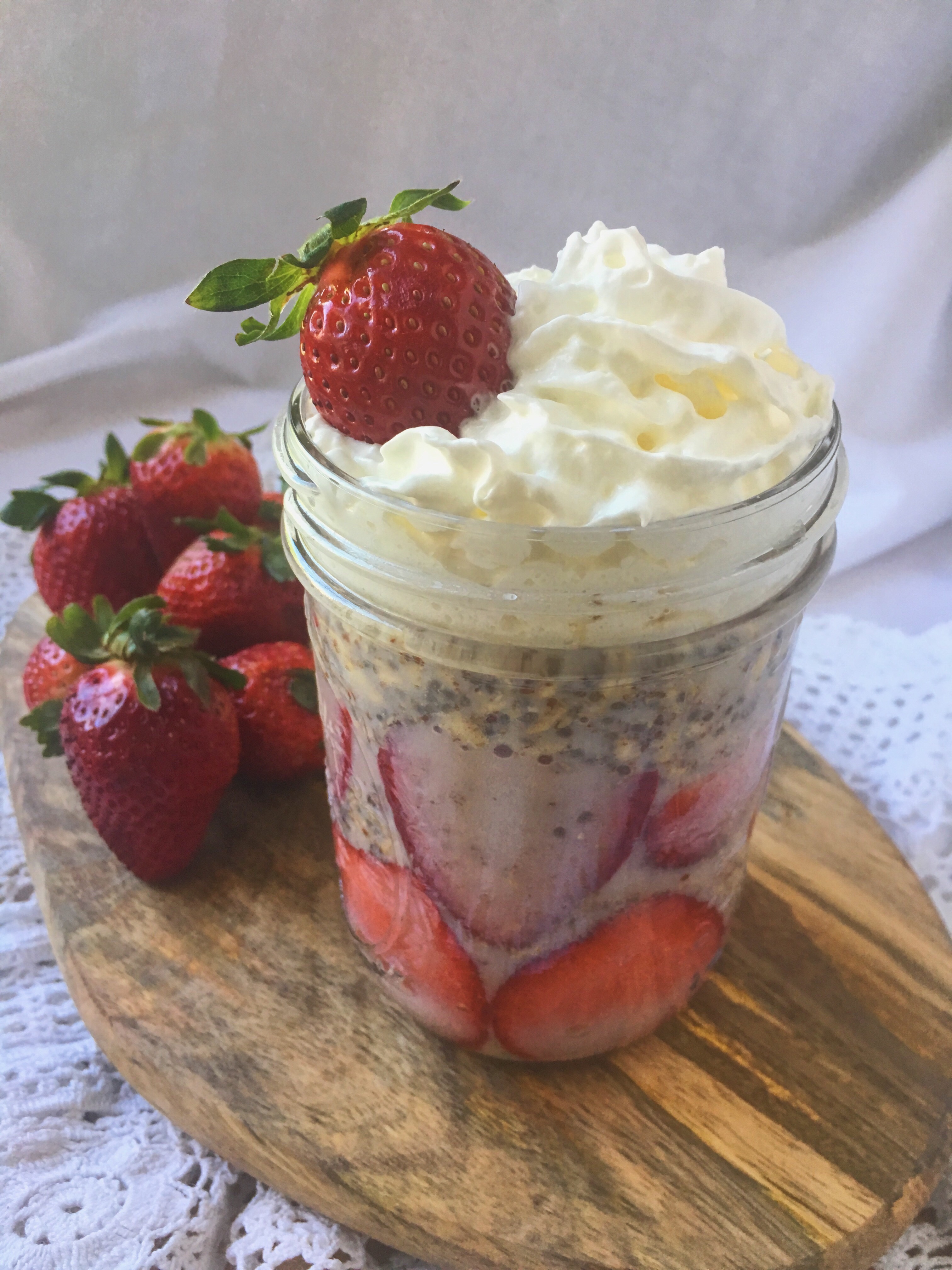 Delicious strawberries and cream overnight oats with chia seeds and flax seeds.