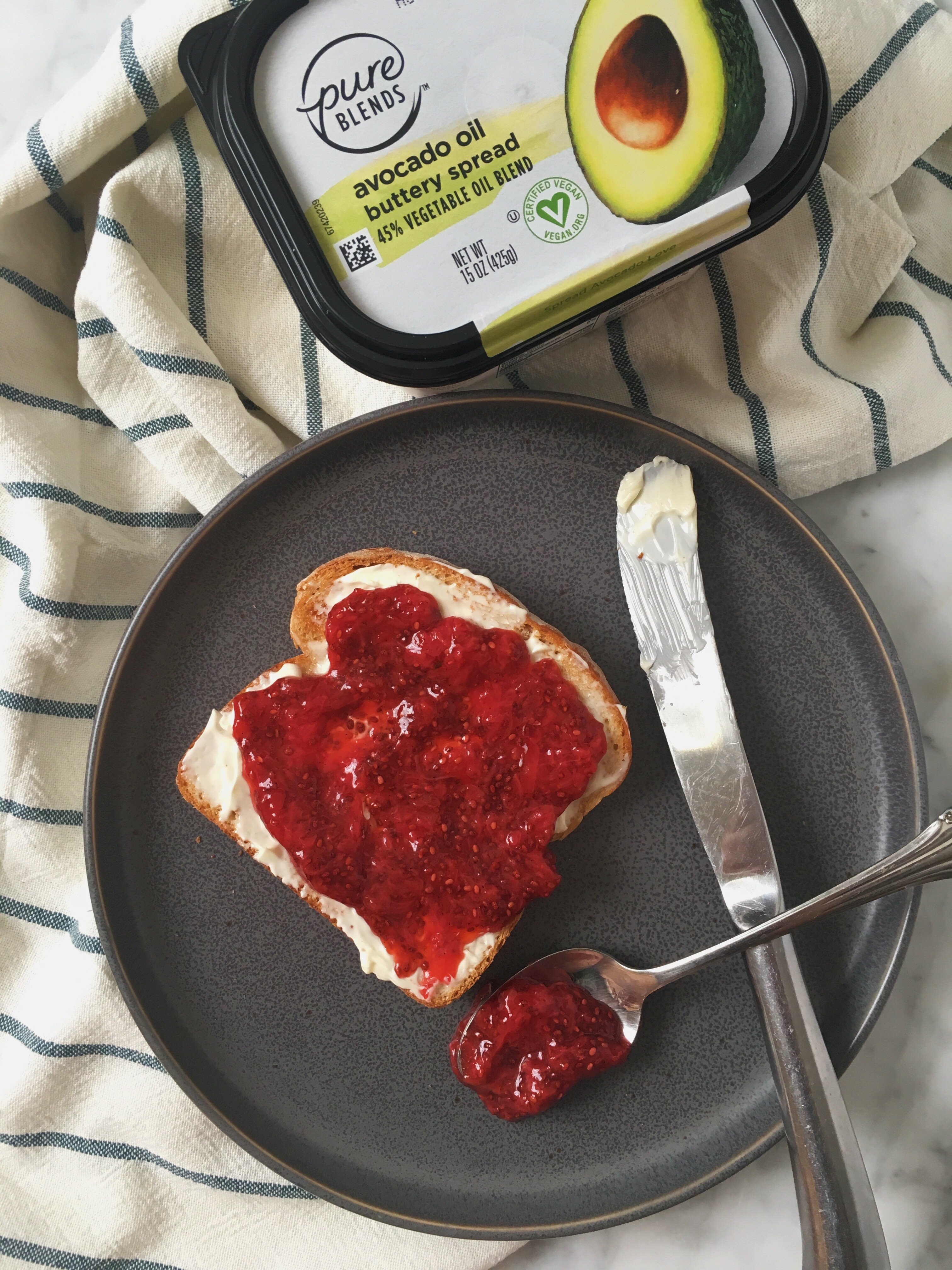 strawberry jam with chia seeds on toast with plant based butter