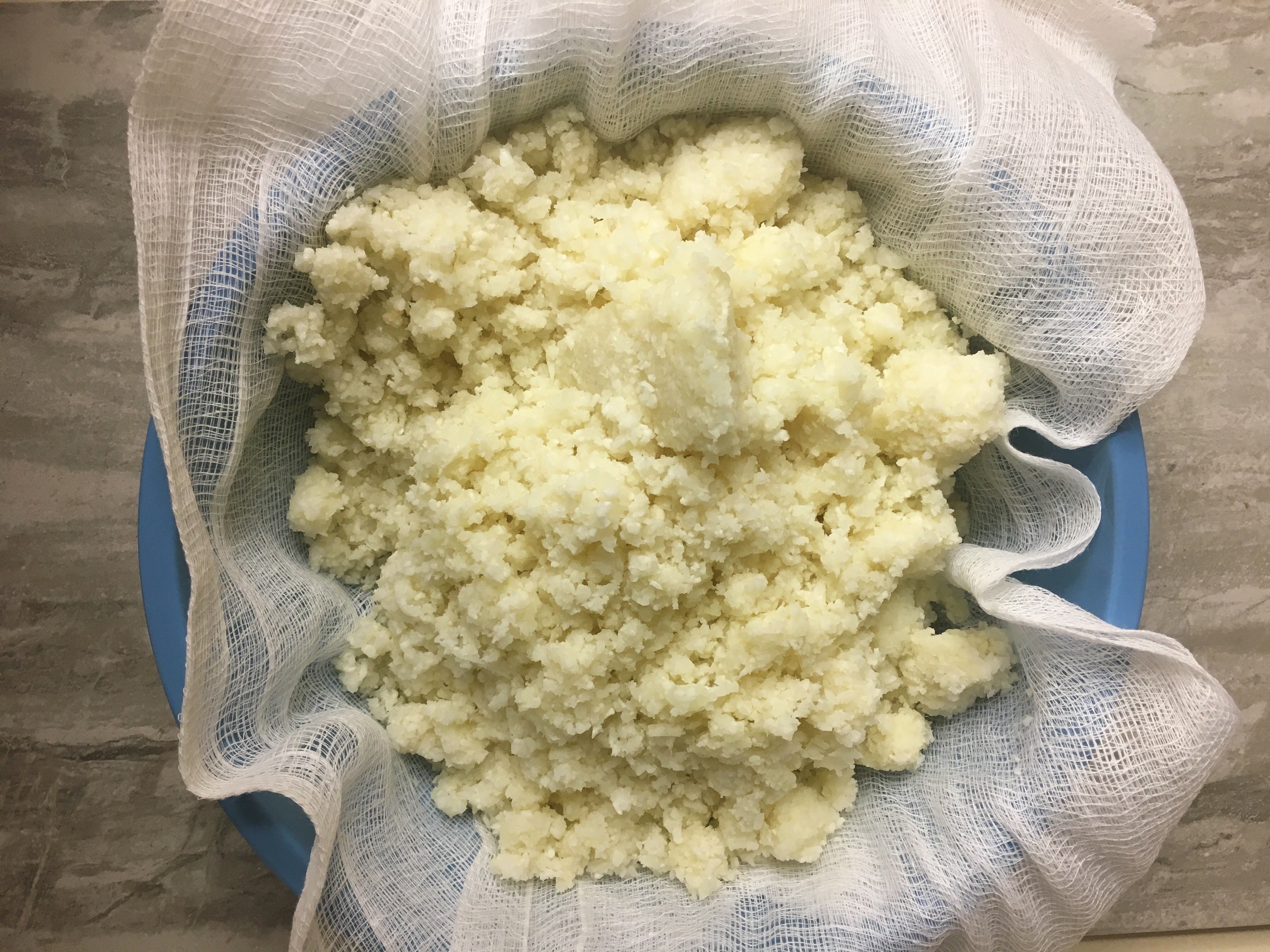 cauliflower in a nice cheese cloth waiting to be drained