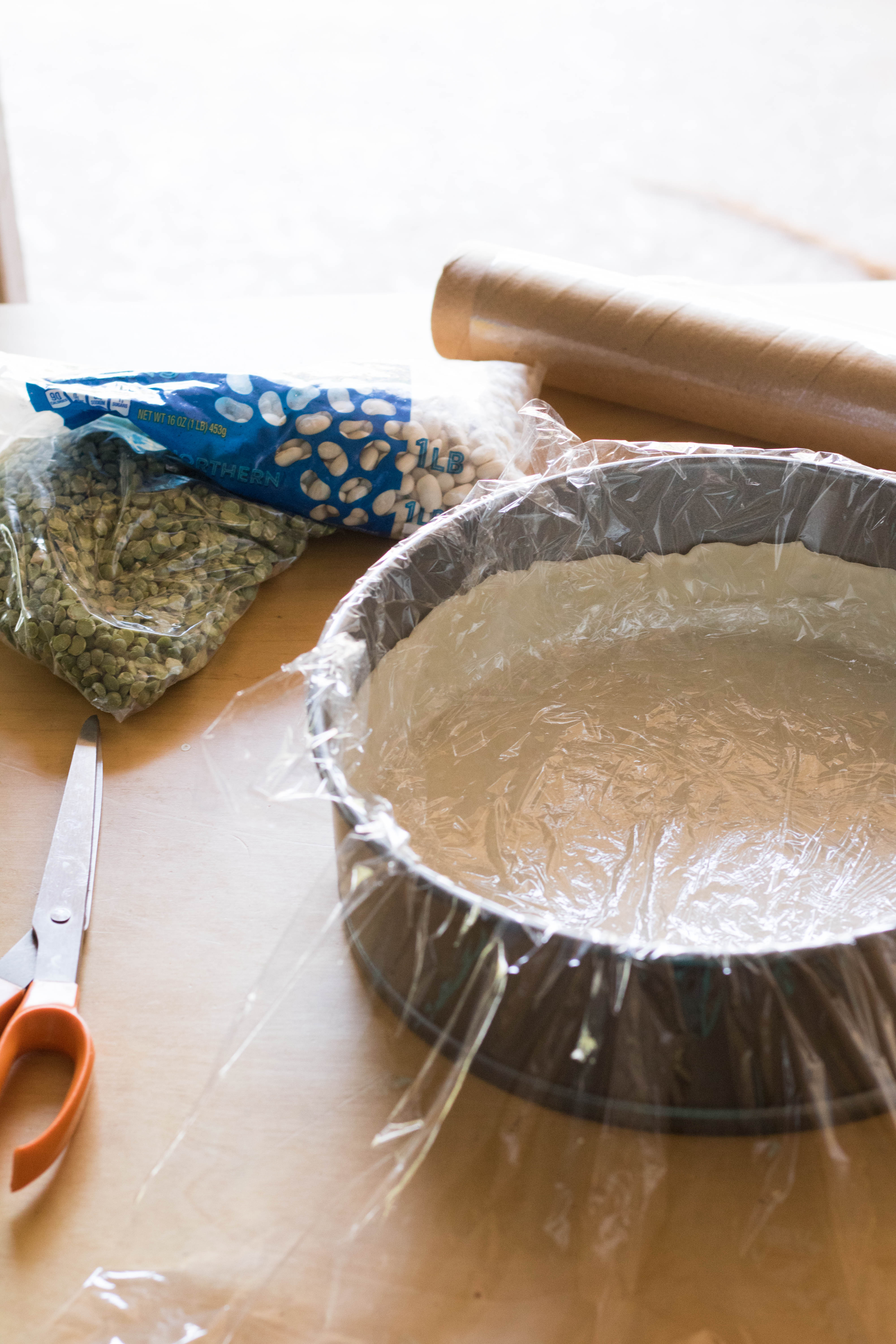 lining the pie crust before baking