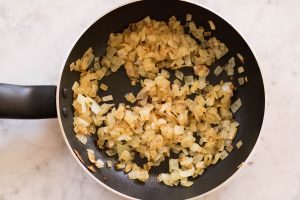 Sweating minced onion on the pan