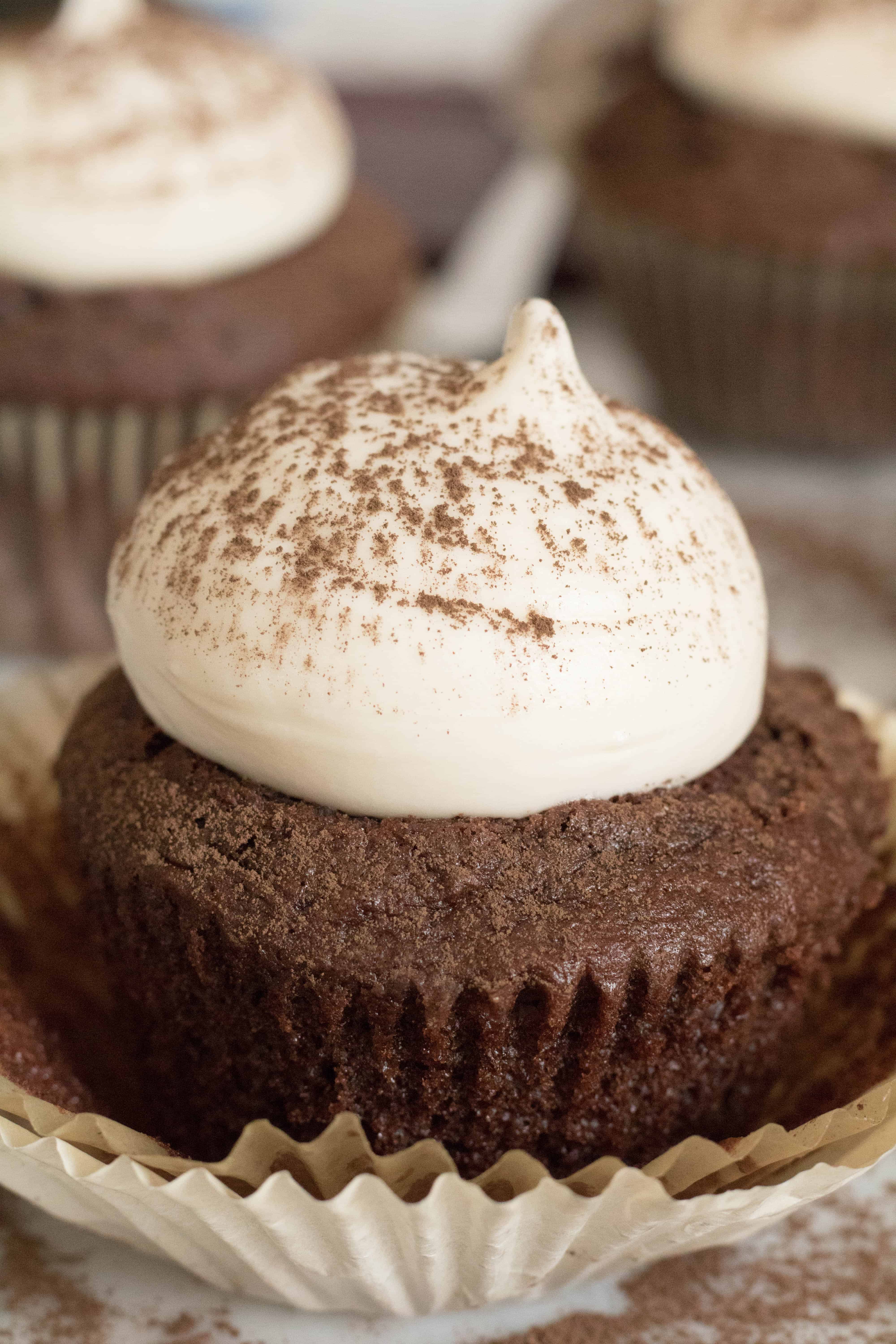 Cream cheese frosting on chocolate cupcake