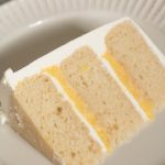 layered vanilla cake with lemon curd and vanilla bean italian meringue buttercream