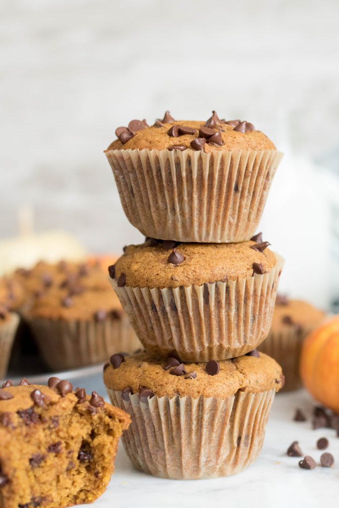 Tall stack of chocolate chip muffins.