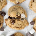 Peanut butter S'mores cookie recipe cut in half with gooey marshmallow center