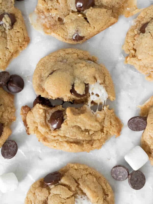 Peanut butter S'mores cookie recipe cut in half with gooey marshmallow center