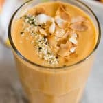 sweet potao in a smoothie topped with hemp seeds and toasted coconut flakes