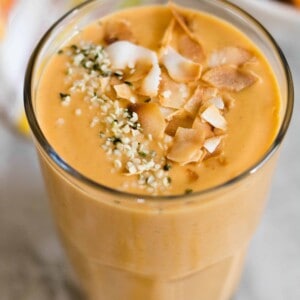 sweet potao in a smoothie topped with hemp seeds and toasted coconut flakes