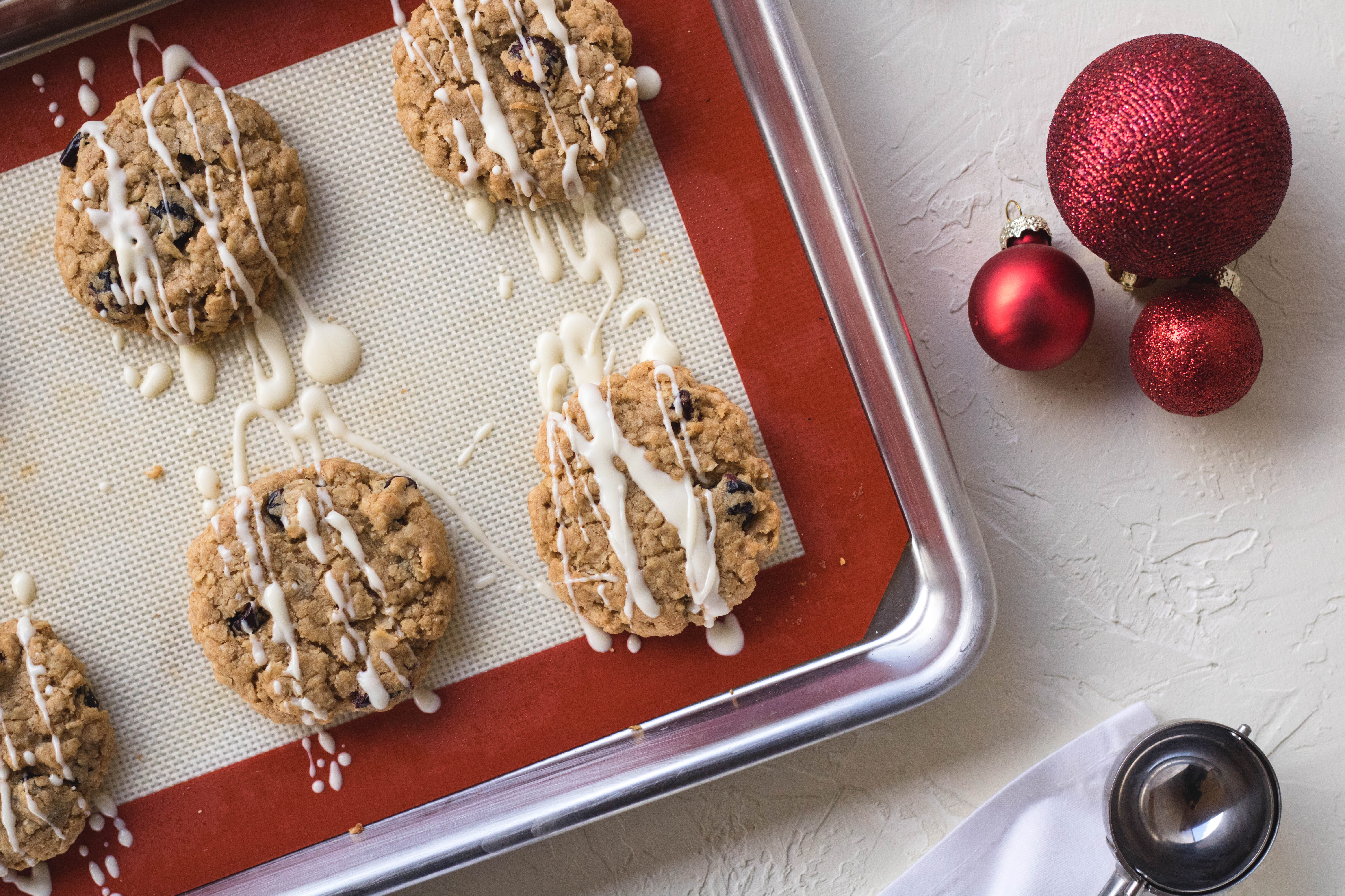 Cranberry oatmeal cookies drizzled in white chocolate