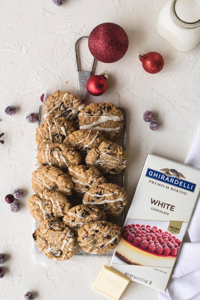 Festile oatmeal and cranberry cookies with ghirardelli white chocolate drizzled on top
