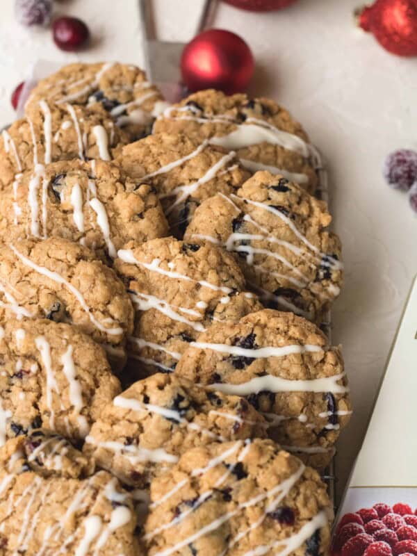 Cranberry oatmeal cookies with white chocolate drizzle on top