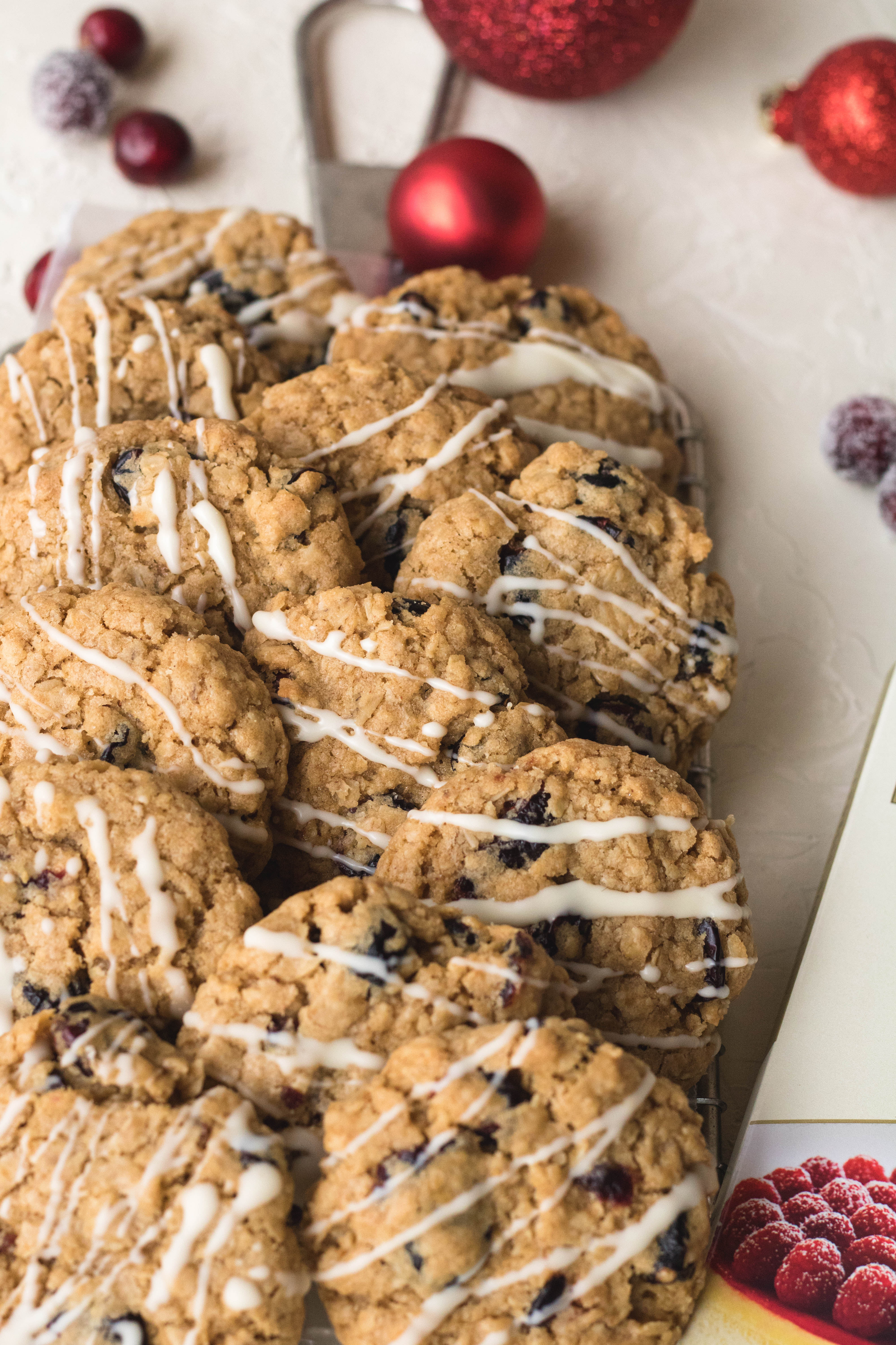 Cranberry oatmeal cookies with white chocolate drizzle on top