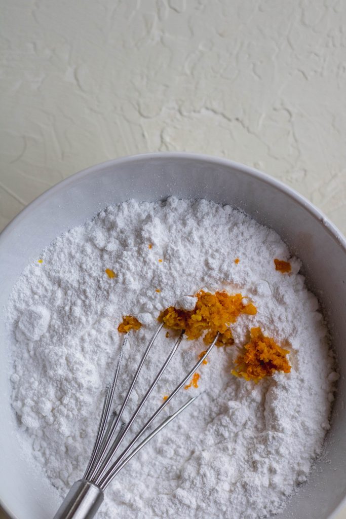 Powdered sugar and orange zest for orange glaze