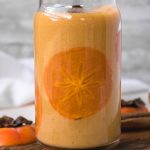 easy persimmon smoothie with a thin slice of persimmon inside