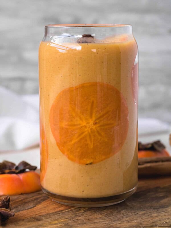 easy persimmon smoothie with a thin slice of persimmon inside