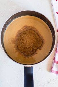 adding coconut sugar to the melted ingredients