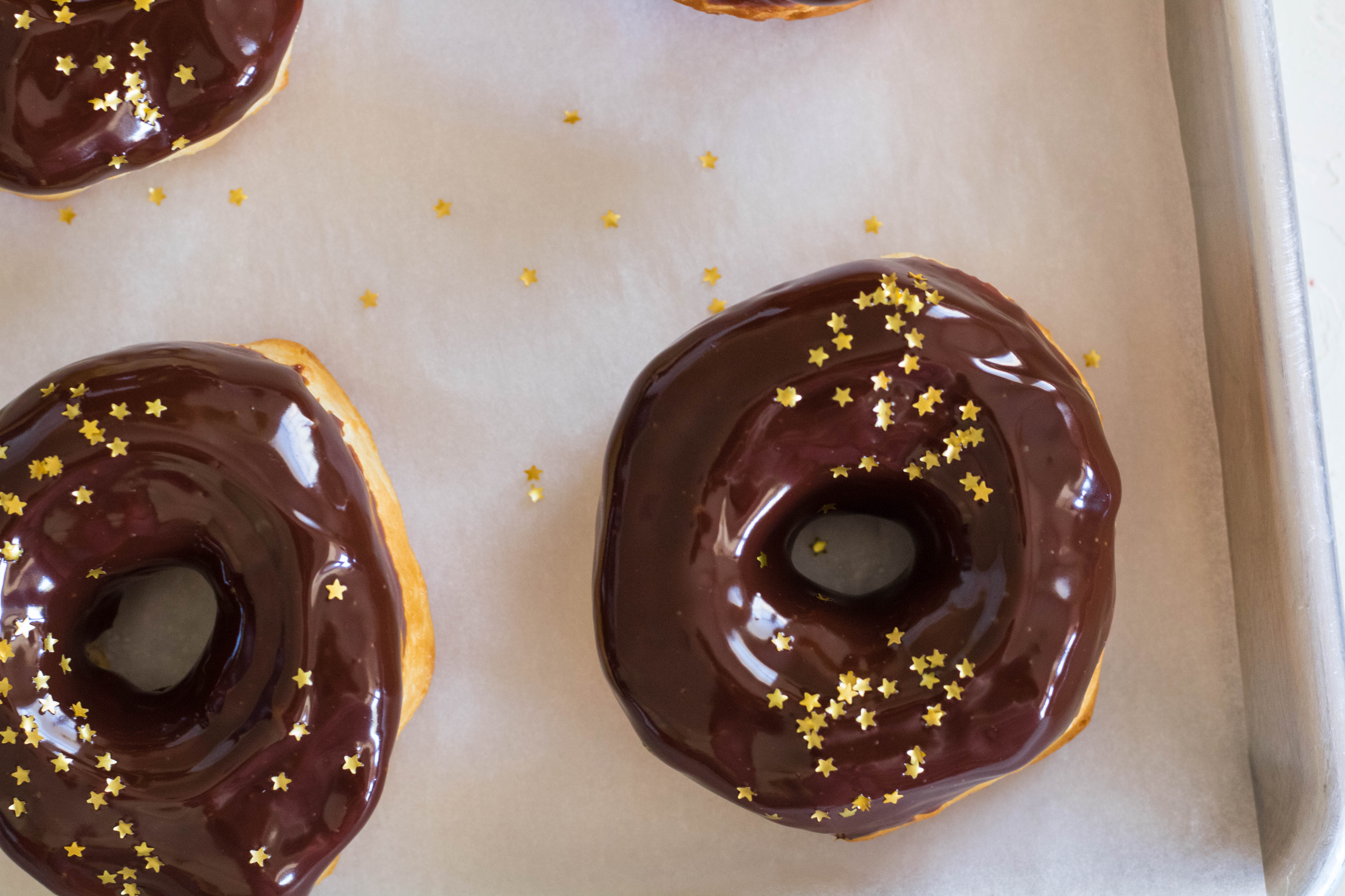 air fryer biscuit donuts with chocolate ganache and godlen stars
