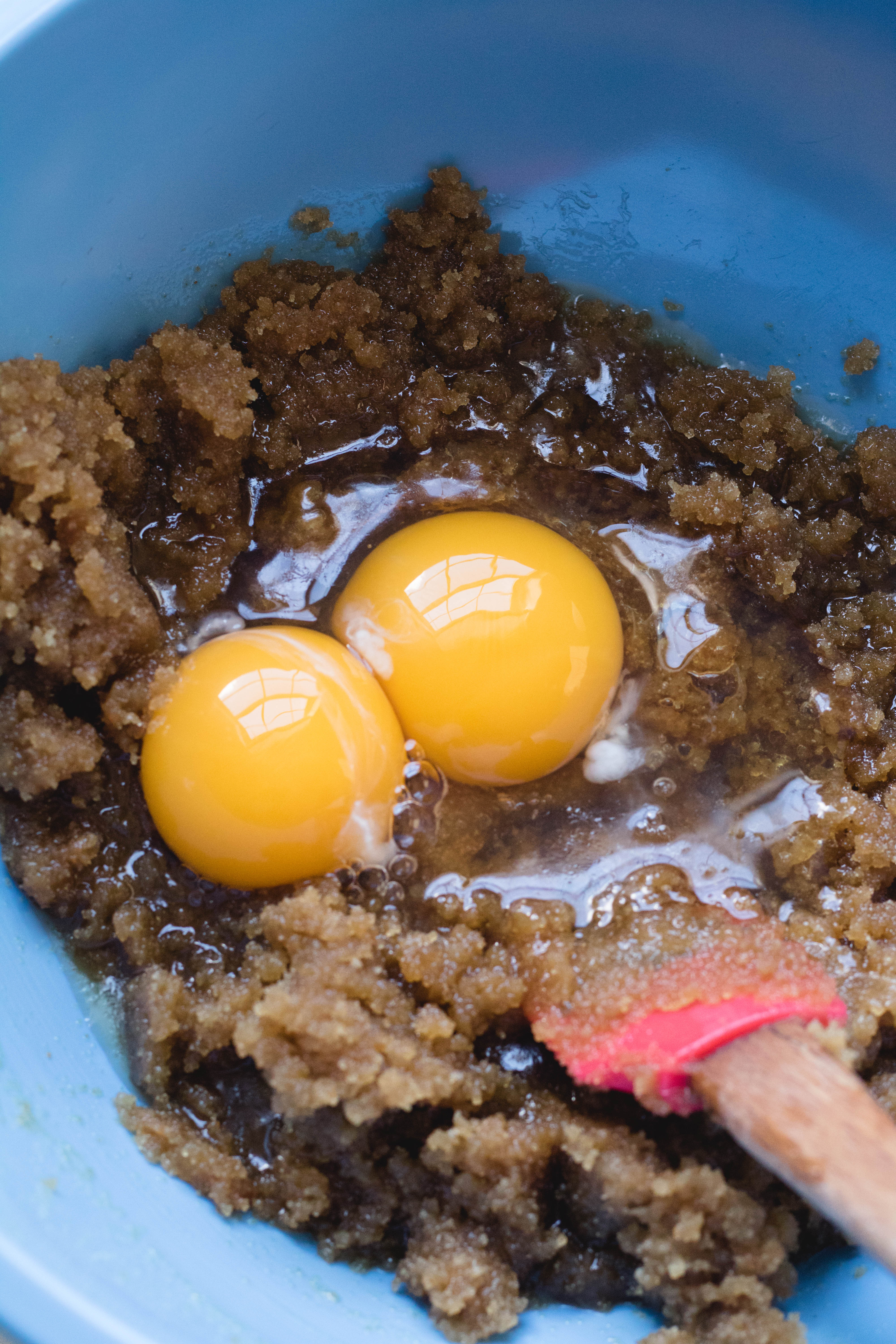 mixing brown sugar and eggs 