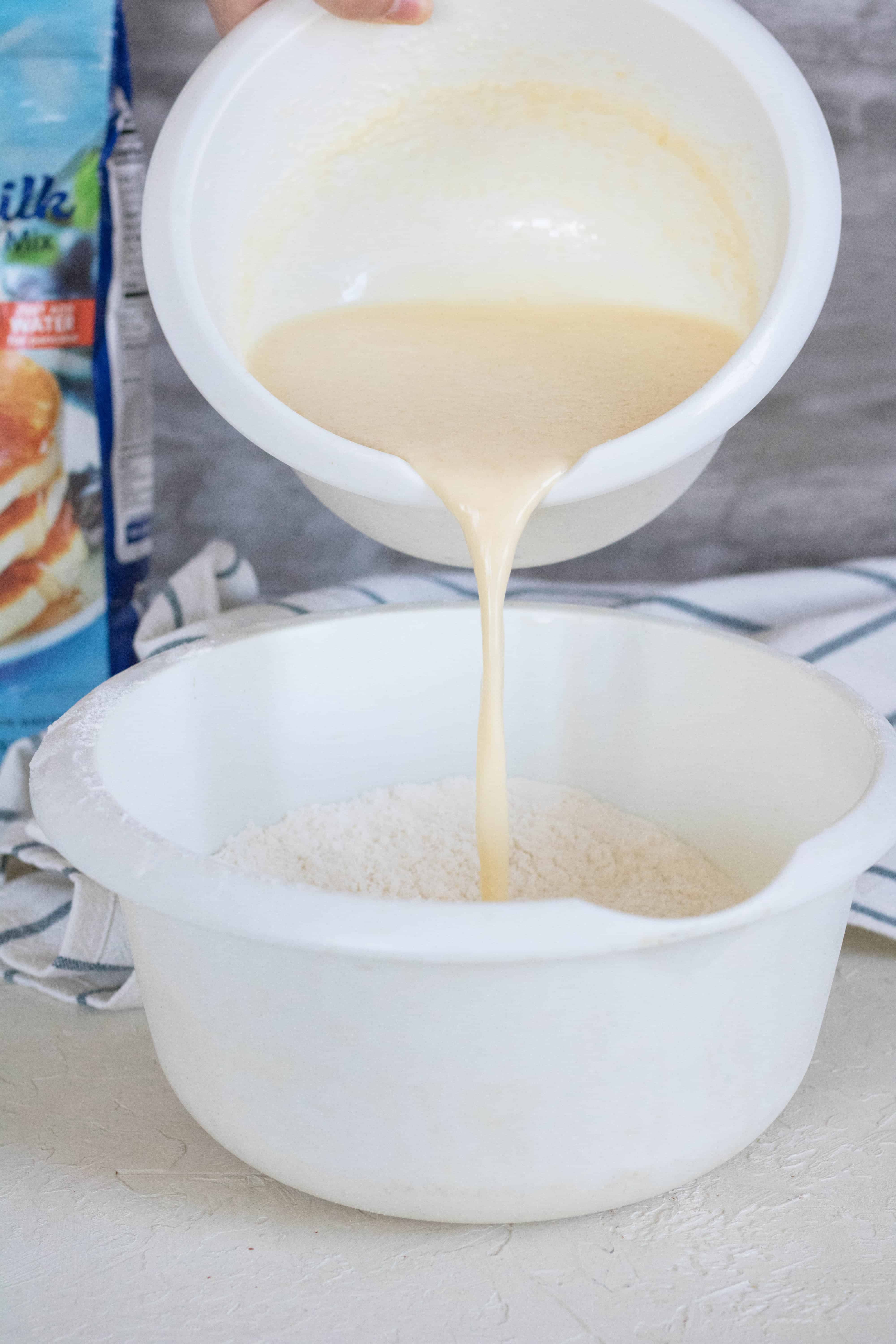 Pouring wet ingredients over the dry ingredients