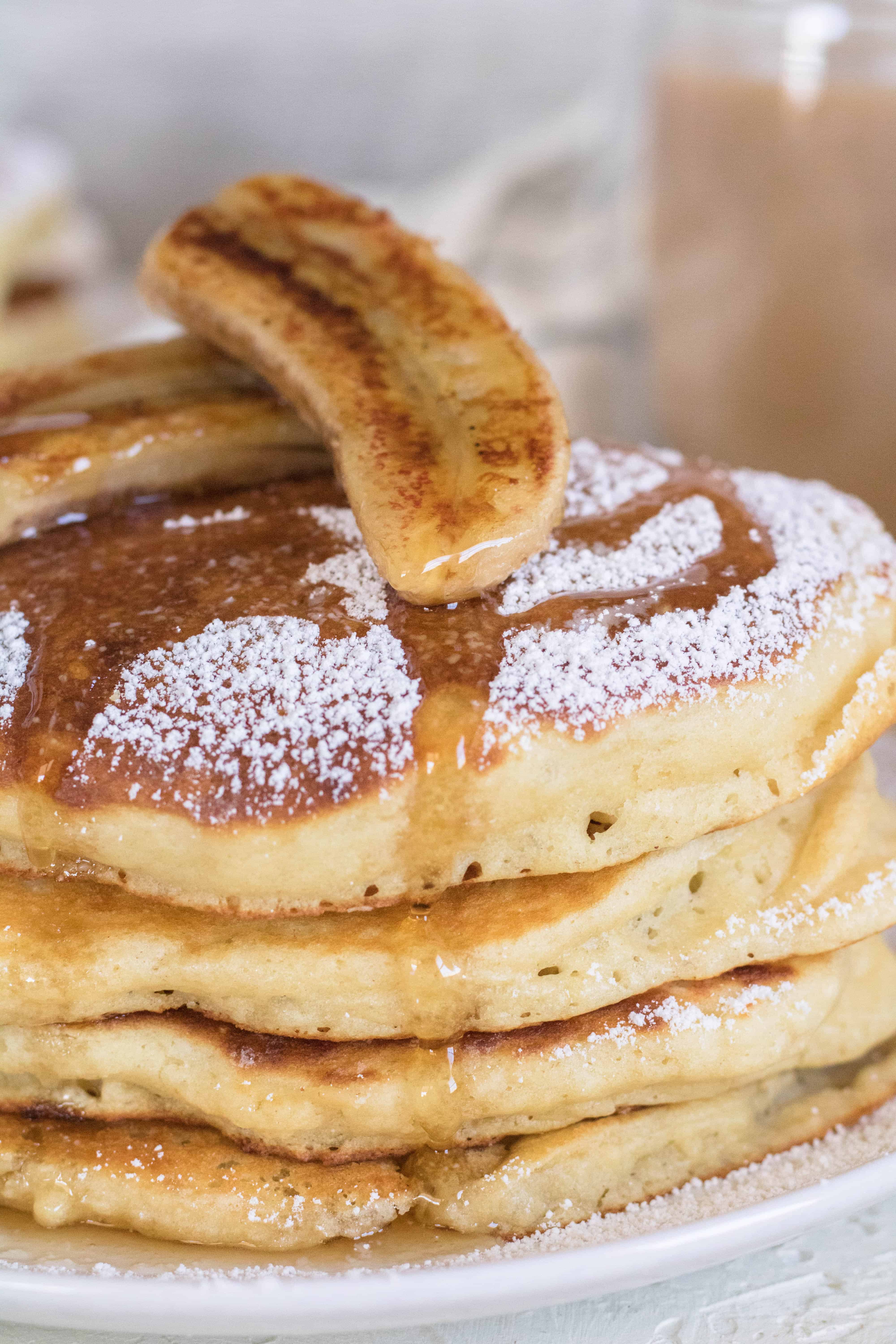 Stack of boxed pancake mix with banana on top