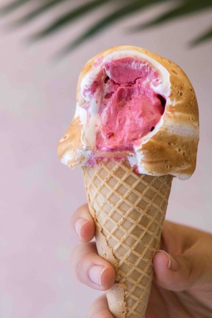 Raspberry sorbet with toasted meringue in a cone
