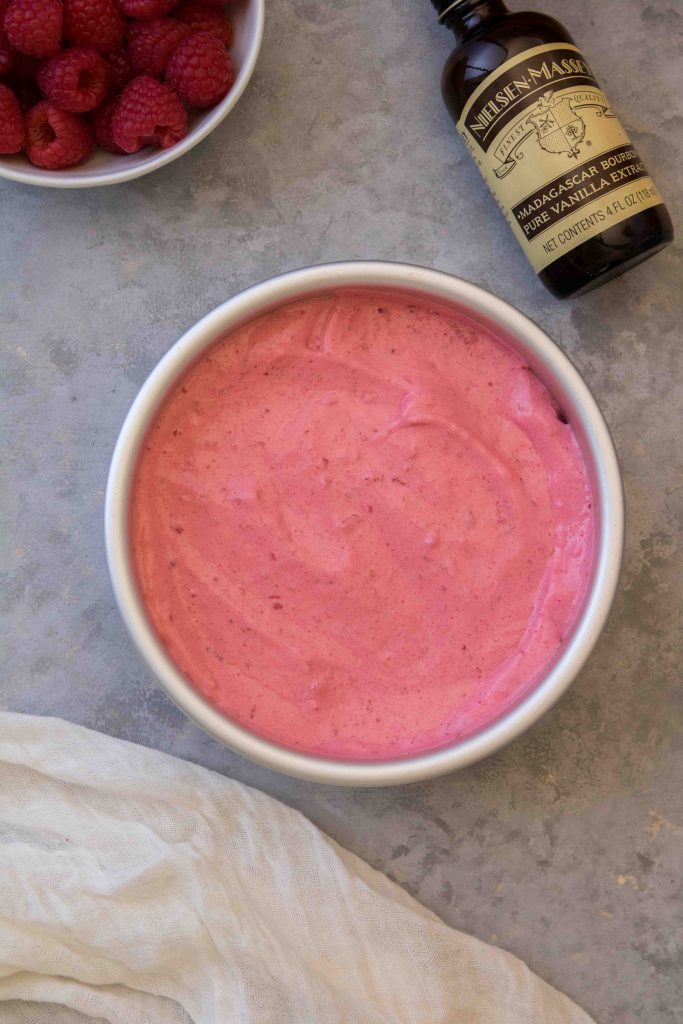 Raspberry mixture in a food processor to make ice cream