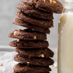 Easy brownie hazelnut cookie stack next to milk