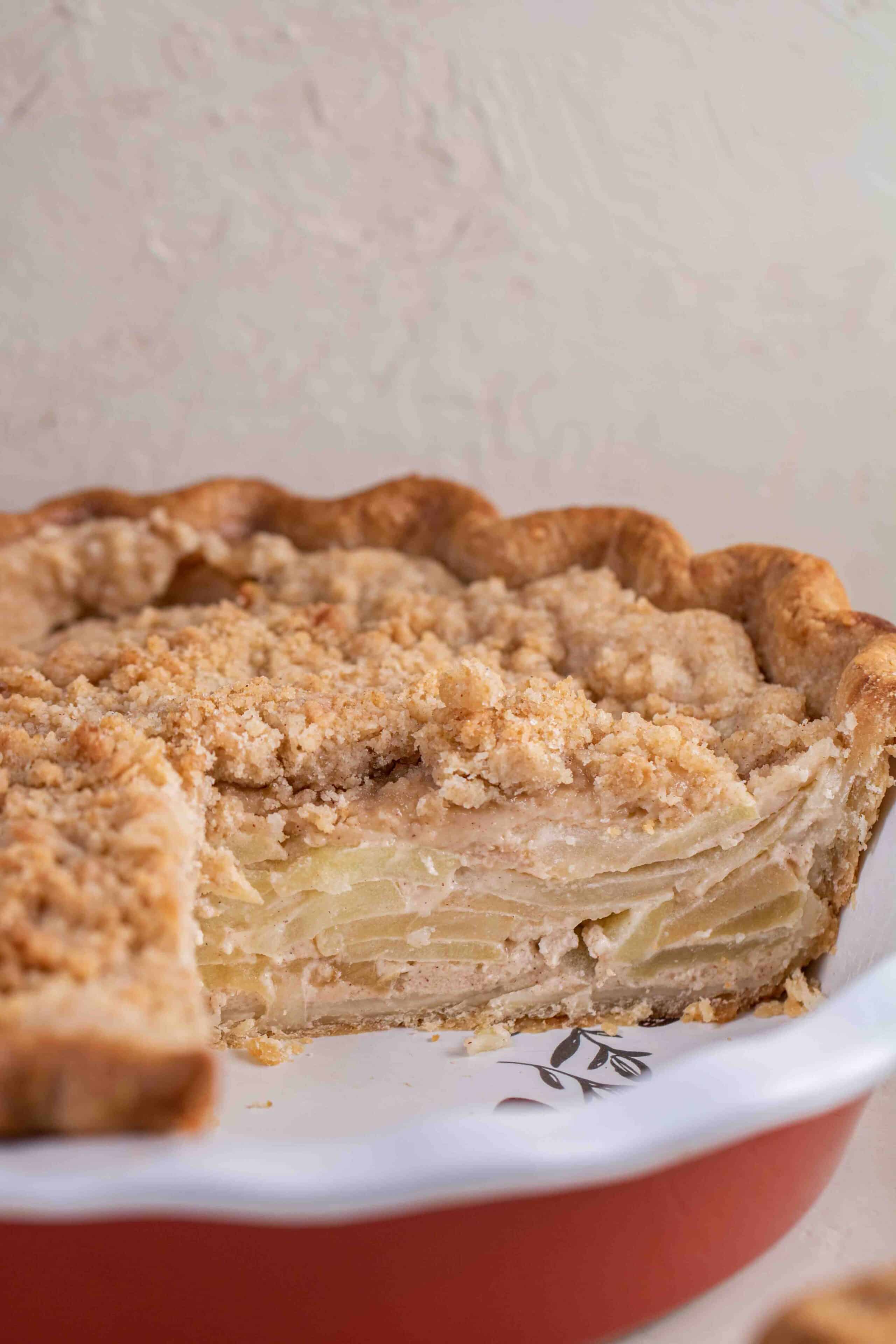 Full apple pie, sliced, showing the interior cooked apple slices