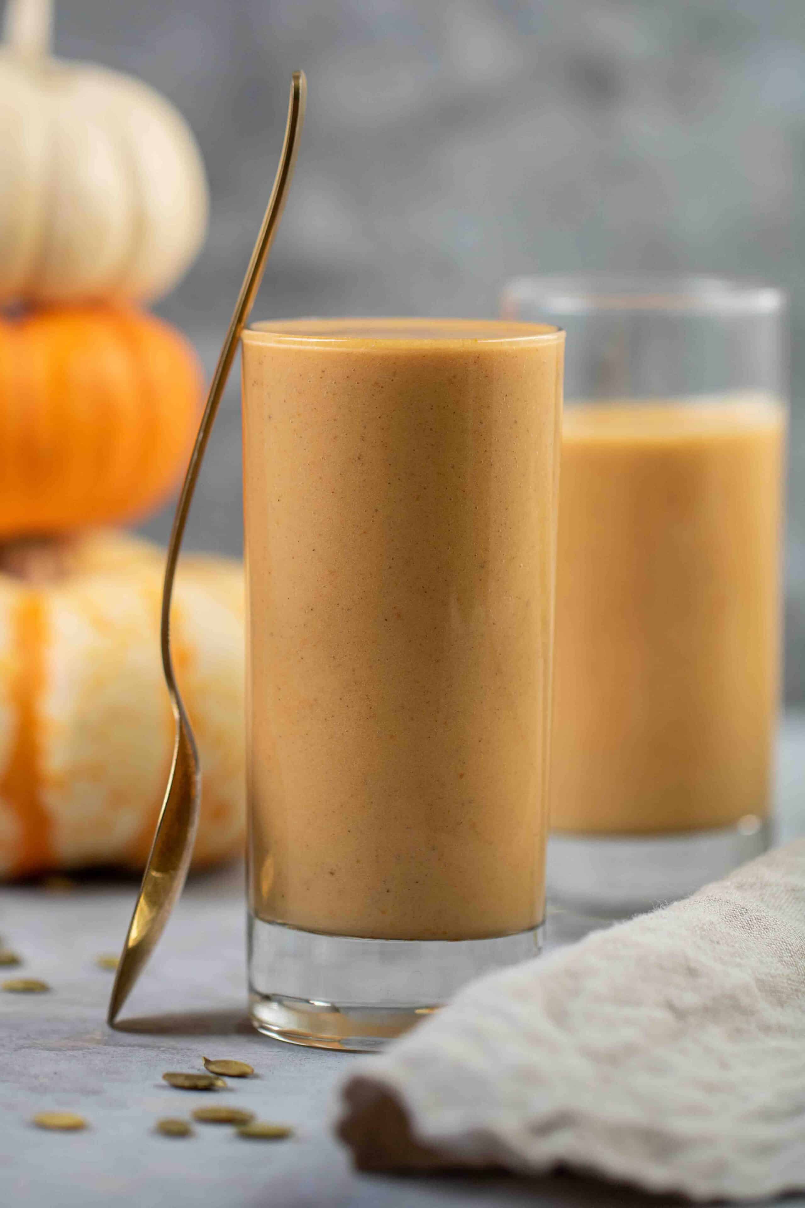 easy pumpkin smoothie with pumpkin in the background