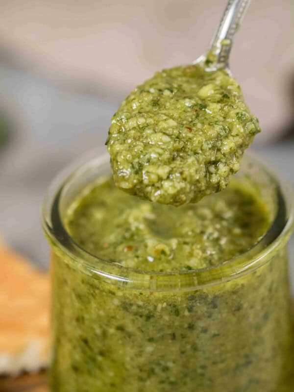 Close up of homemade pesto in a spoon recipe