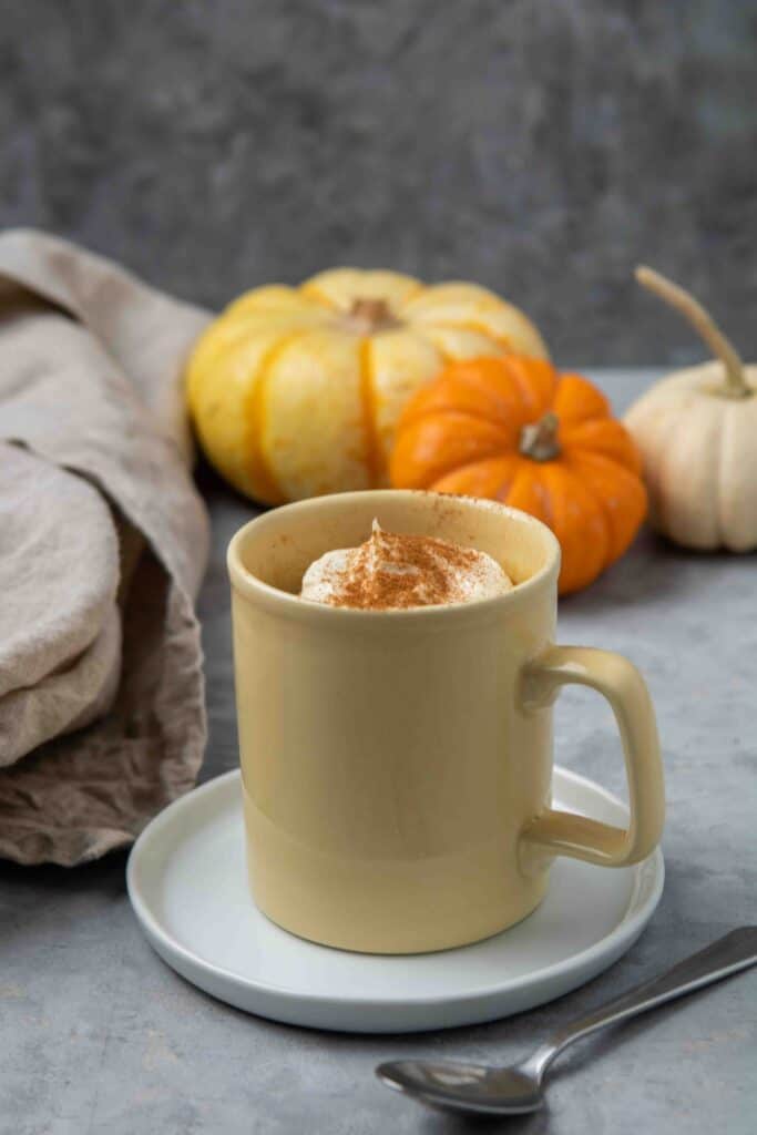 Close up of the pumpkin cake in a yellow mug