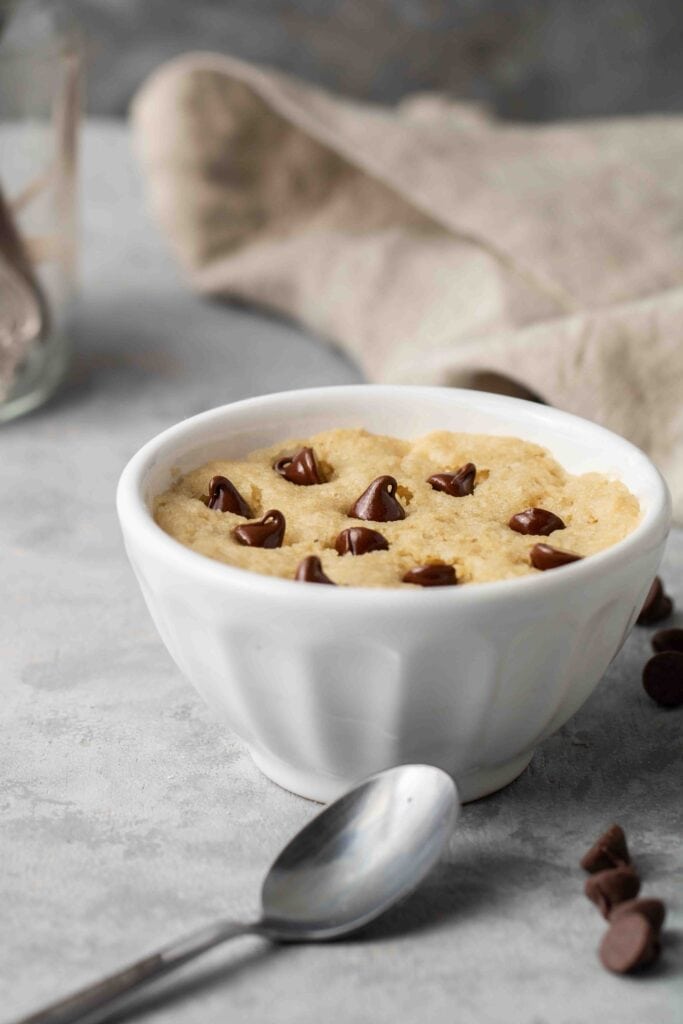 spoon next to the vegan and healthy chocolate chip cookie