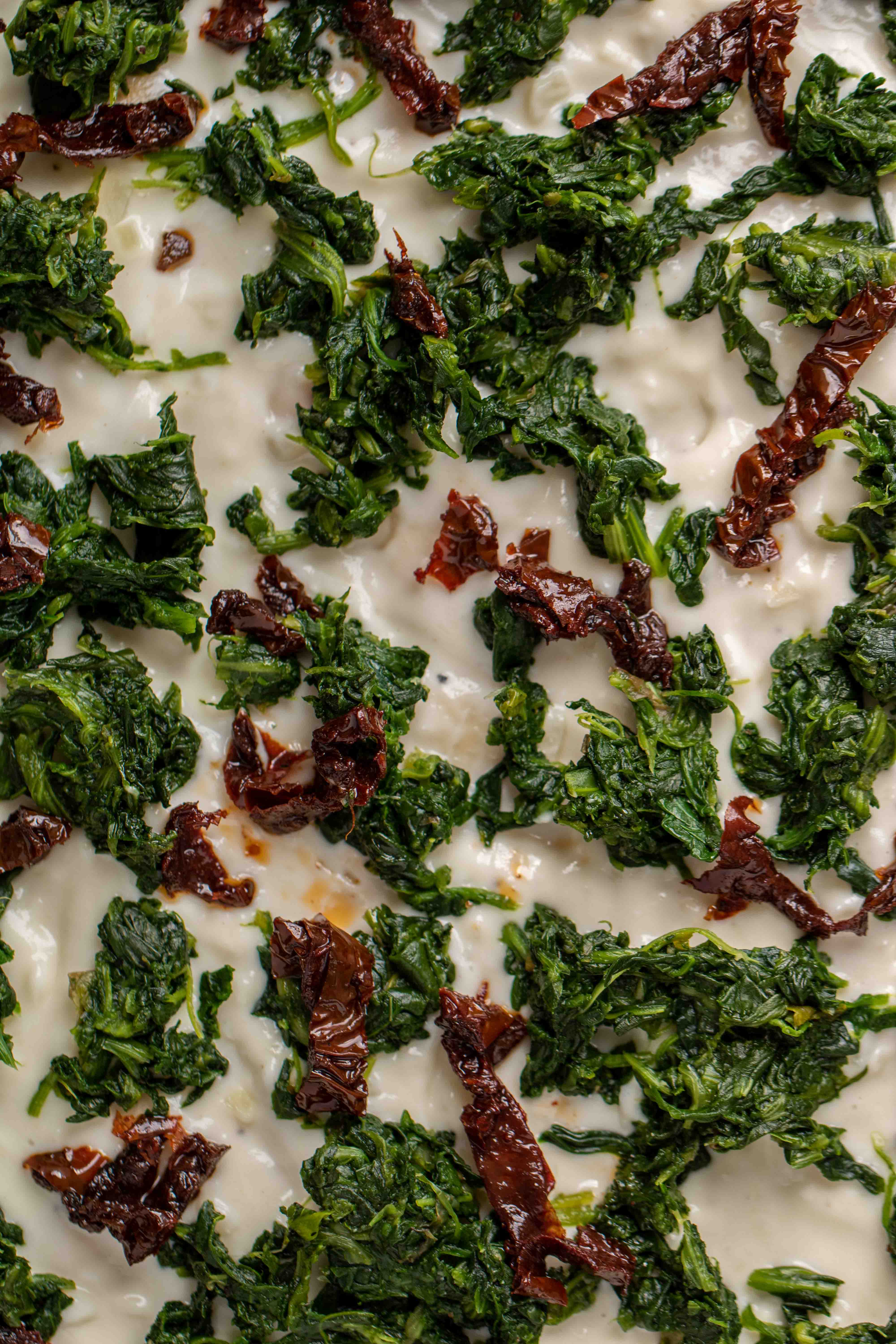 Close up of Spinach and sun dried tomato pizza recipe