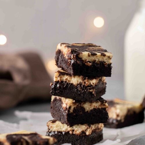 Stack of perfectly chewy cream cheese brownies