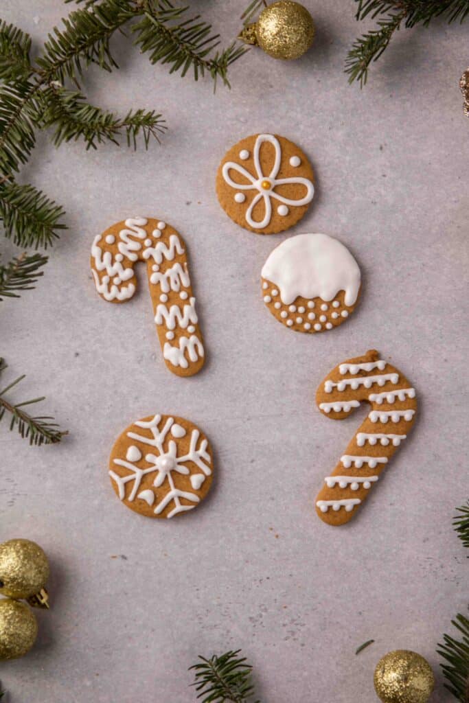 Assorted holiday cookie shapes decorated with royal icing