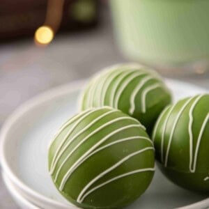 Close up of white hot chocolate green tea bombs