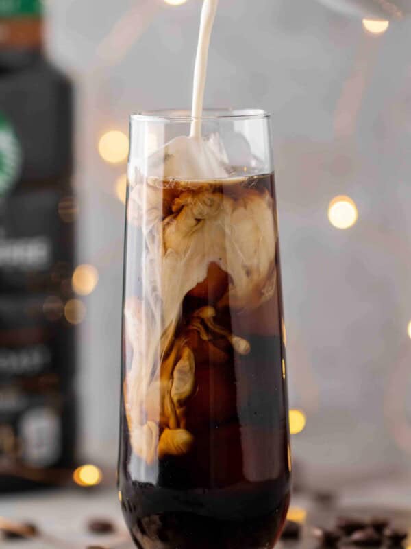 Pouring-sweet-cream-over-cold-brew
