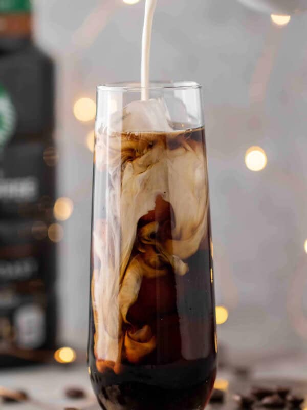 Pouring-sweet-cream-over-cold-brew