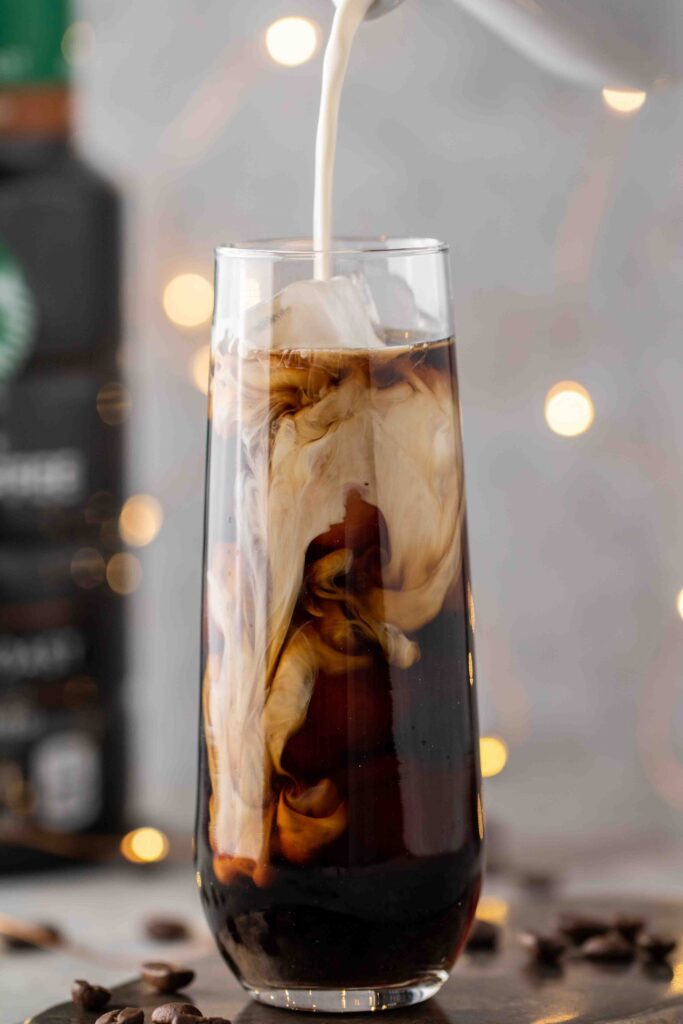 Pouring-sweet-cream-over-cold-brew