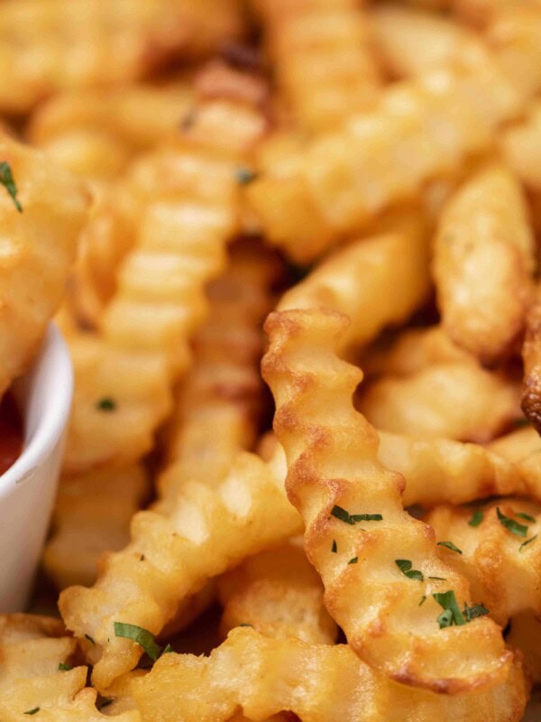 Close up of crunchy air fryer frozen crinkle fries