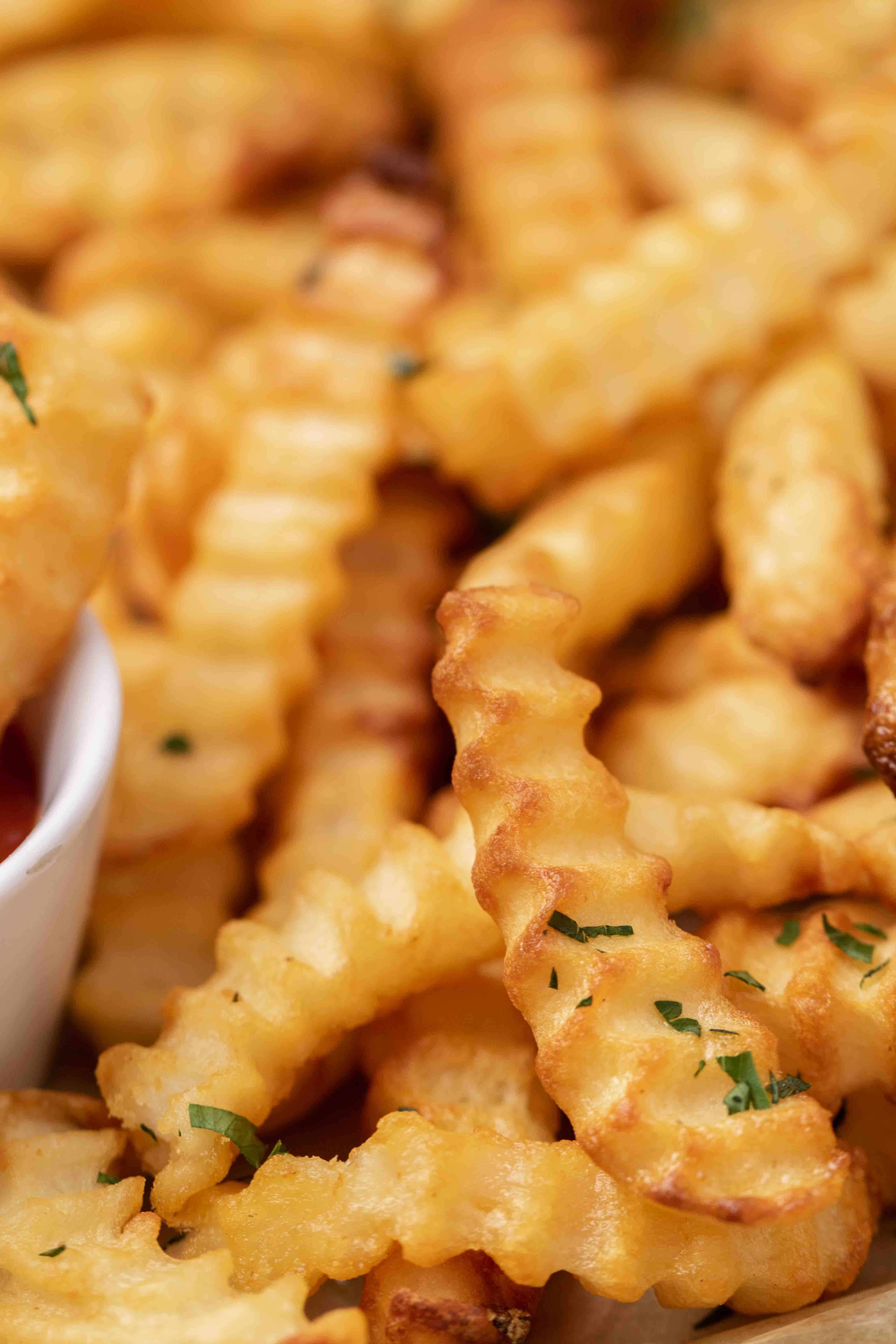 Close up of crunchy air fryer frozen crinkle fries