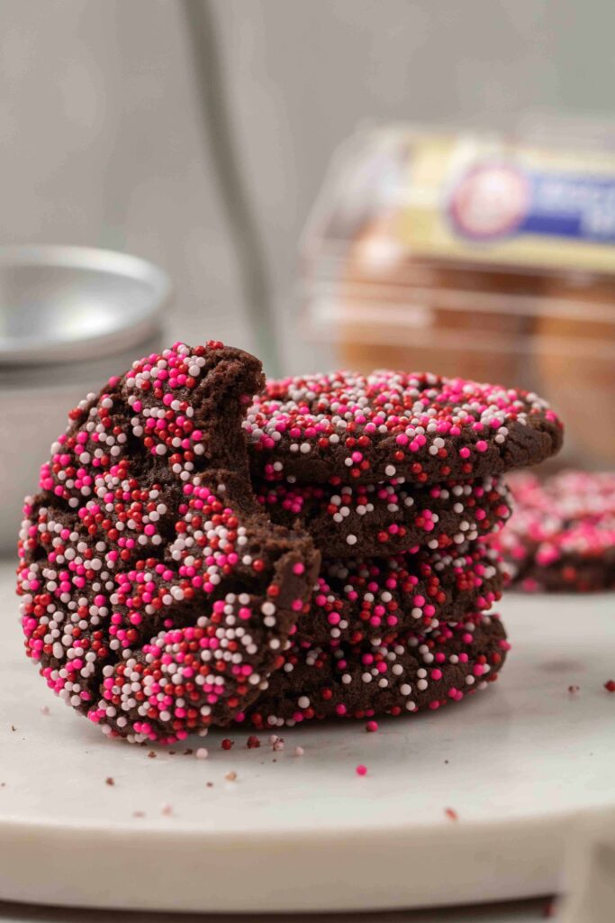 Stack of pink pink sprinkle chocolate cookies