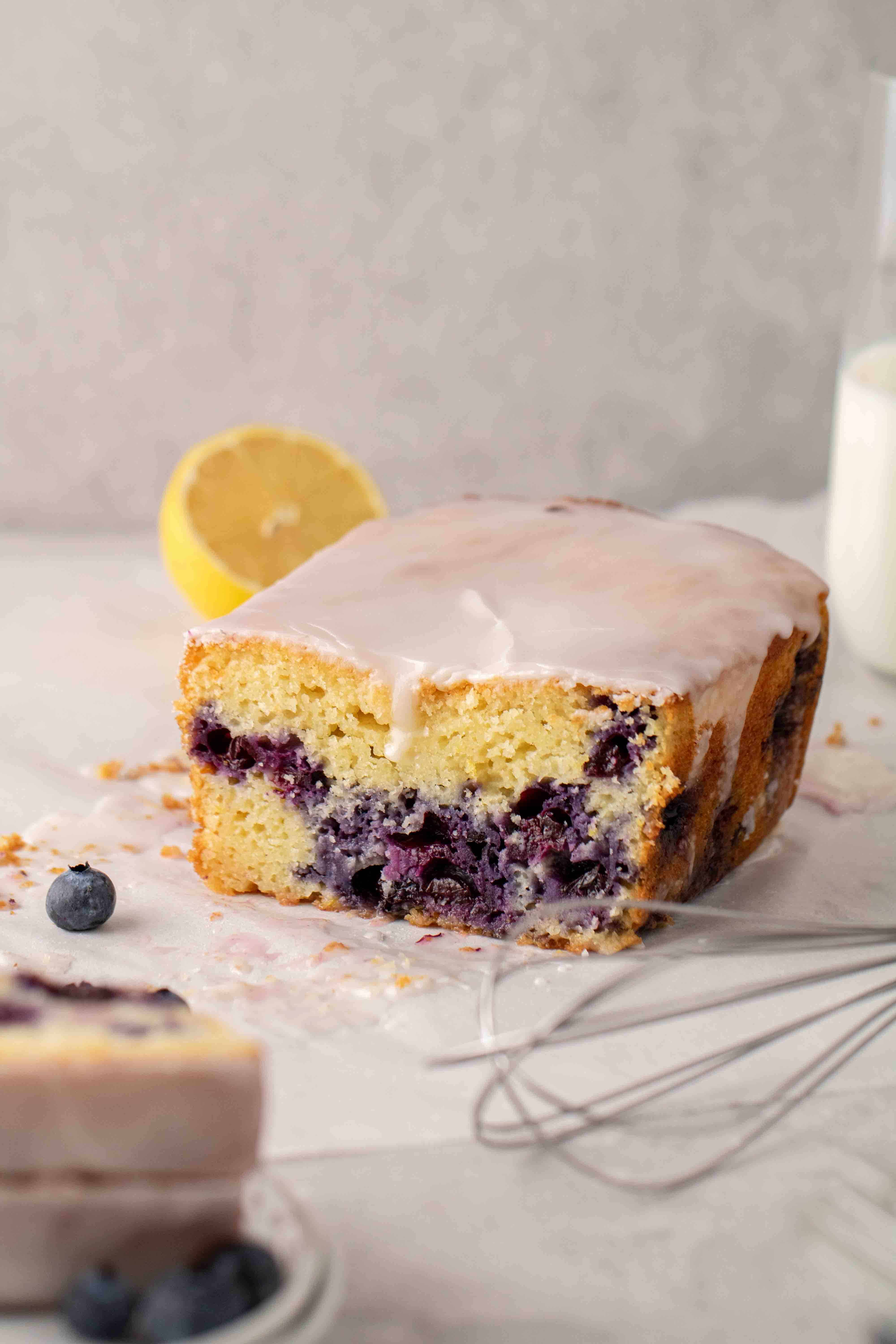 Sliced loaf cake with blueberries and lemon