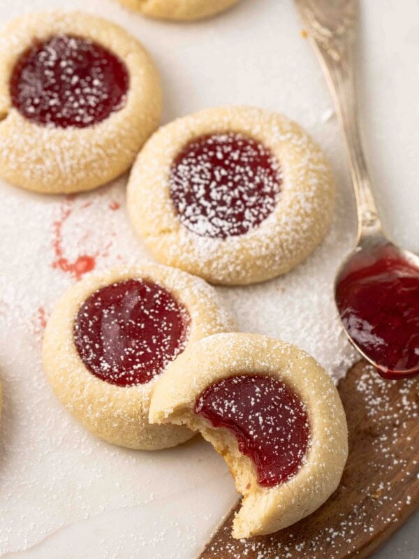 Strawberry thumbprint cookies with a spoon full of jam