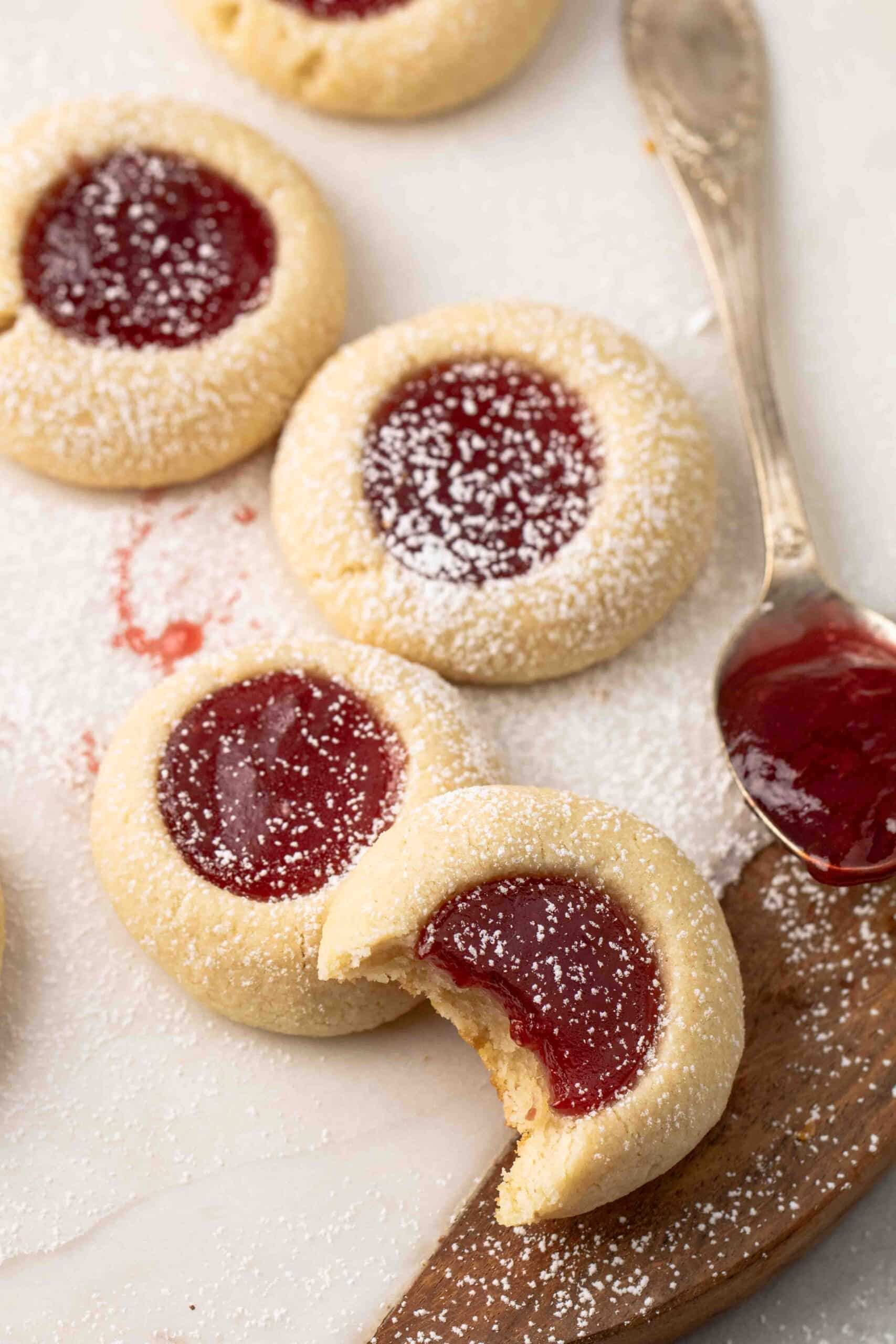 Strawberry thumbprint cookies with a spoon full of jam