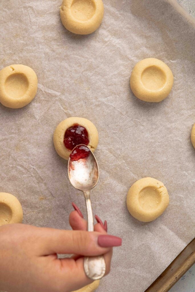 Fill the thumbprint cookies with jam