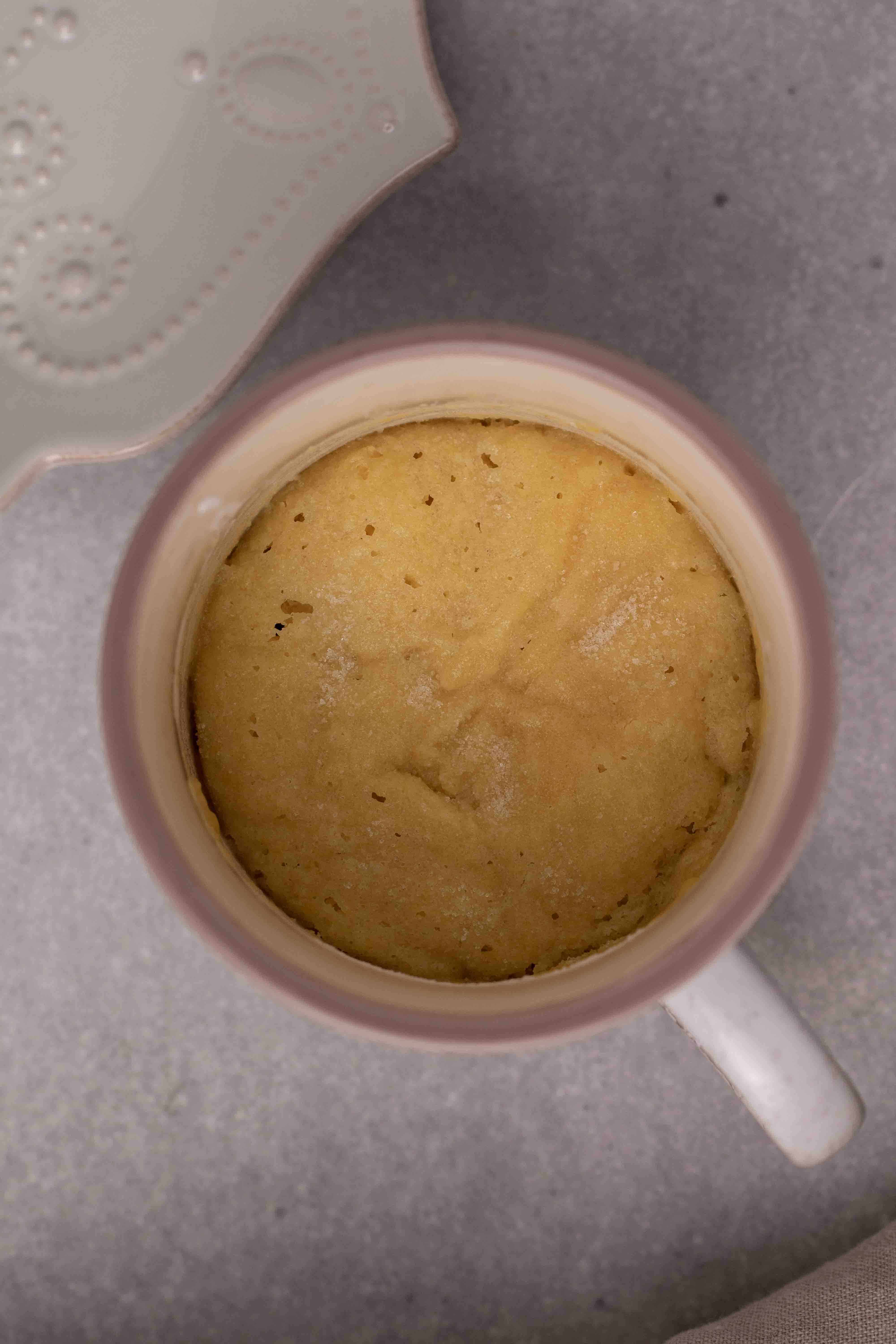 Overhead shot of soft sugar cookie in the microwave