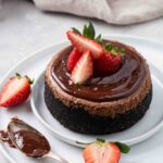 Chocolate cheesecake with chocolate ganache and strawberry on top