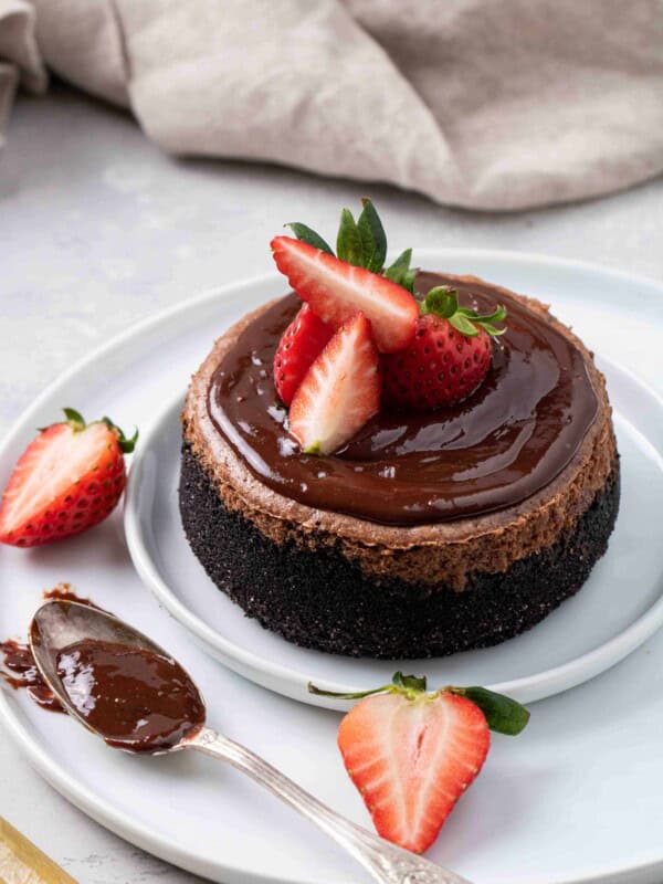 Chocolate cheesecake with chocolate ganache and strawberry on top