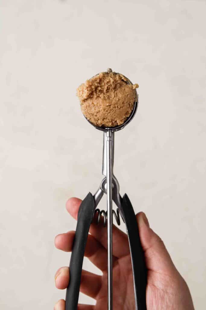 Peanut butter cookie dough in a cookie scooper